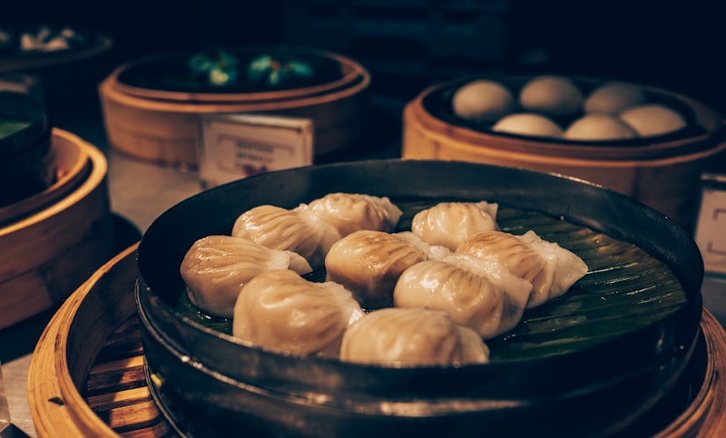 A lively morning scene at a hutong street vendor's stall with steam rising from boiling noodles.