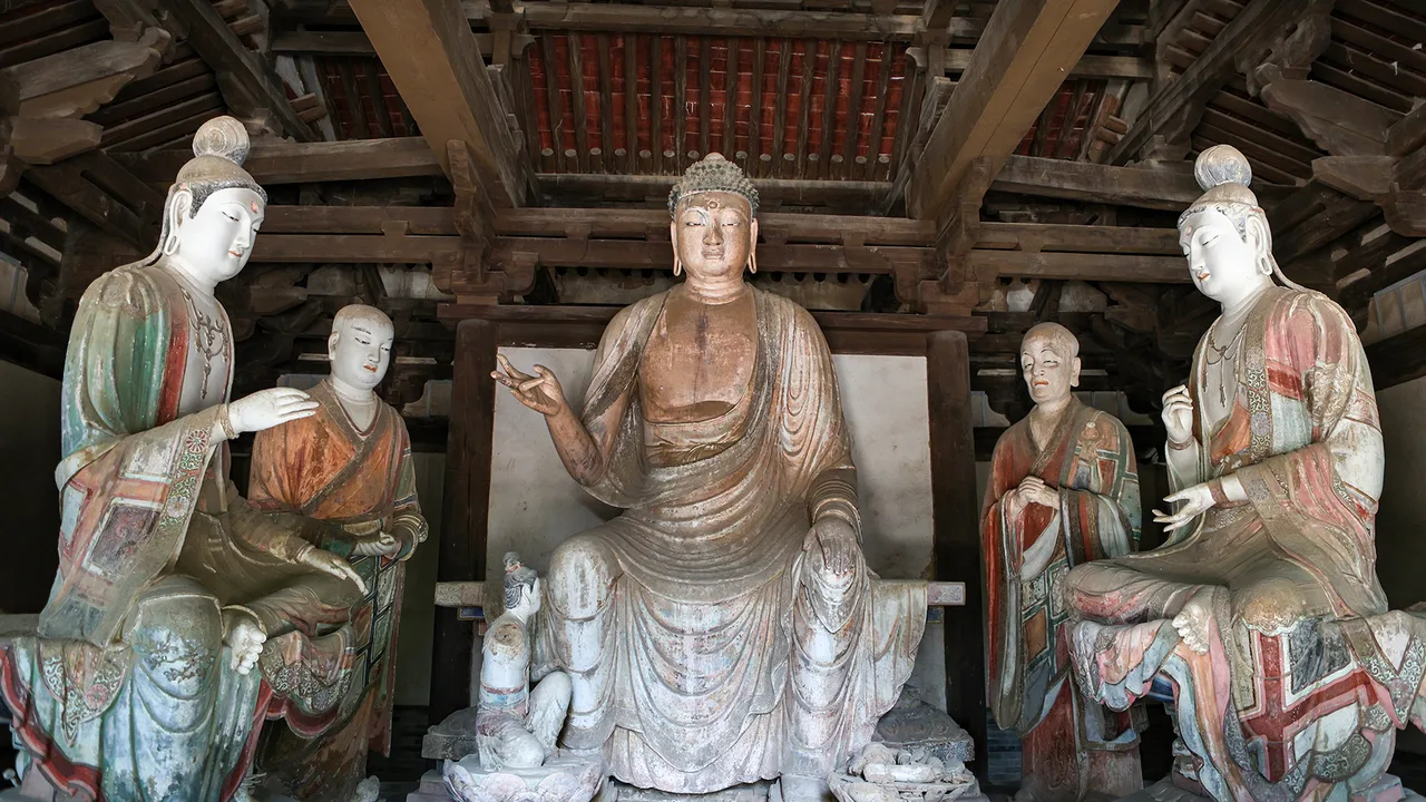 Painted clay Buddha and attendant figures inside the Lower Qinglian Temple near Jincheng.
