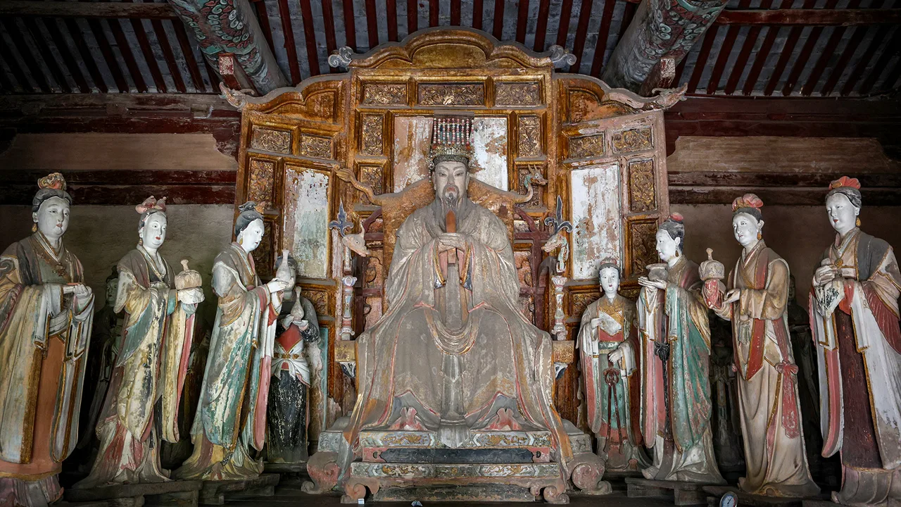 Painted clay deity figures seated and standing in a hall at Yuhuang Temple, Fucheng, Jincheng.