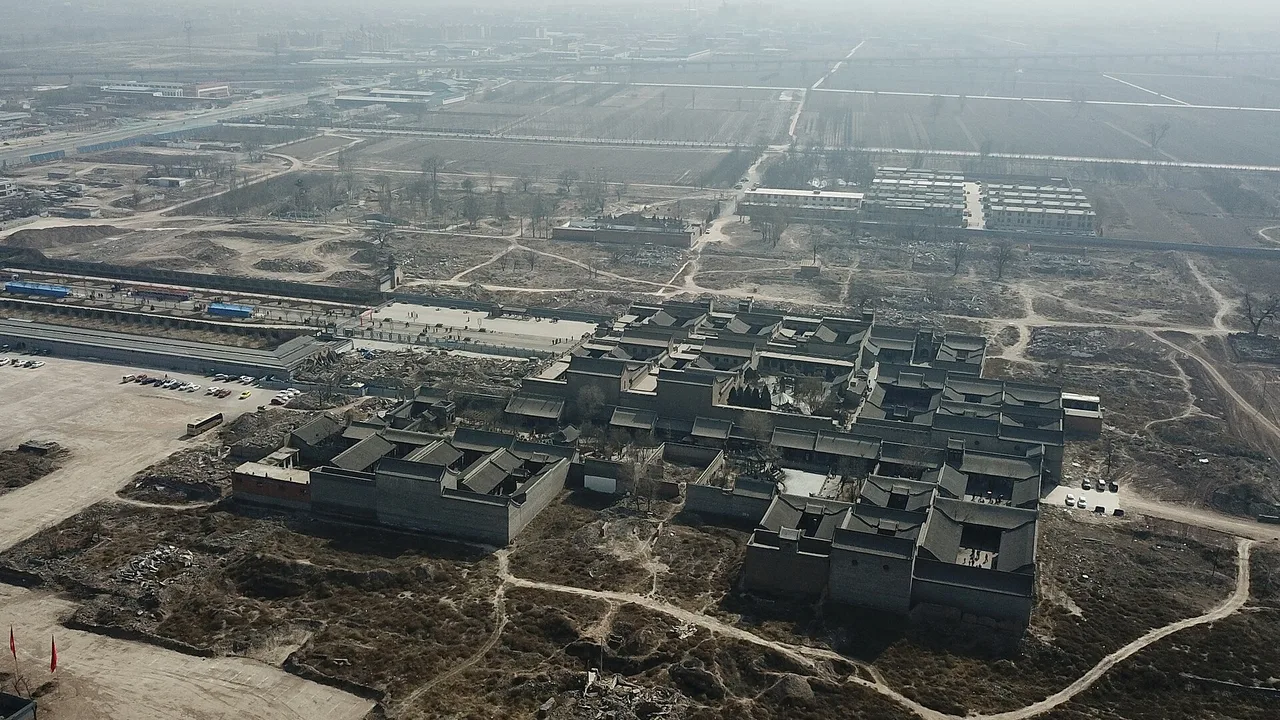 An elevated view over the grey-tiled roofs and courtyards of the Qiao Family Compound in Qixian.