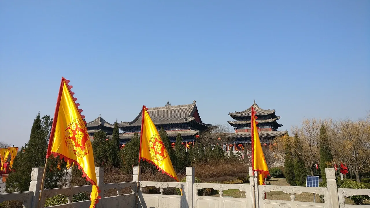 Yellow ceremonial banners and memorial halls at the Hongdong Big Locust Tree Root-Seeking Park.