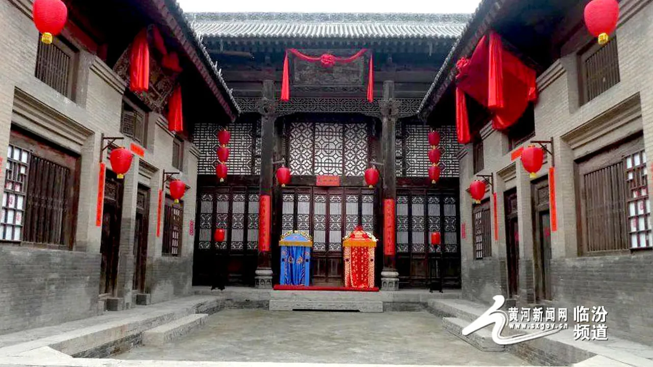 A Ming–Qing courtyard in Ding Village, Xiangfen, with carved timber facades and red lanterns.