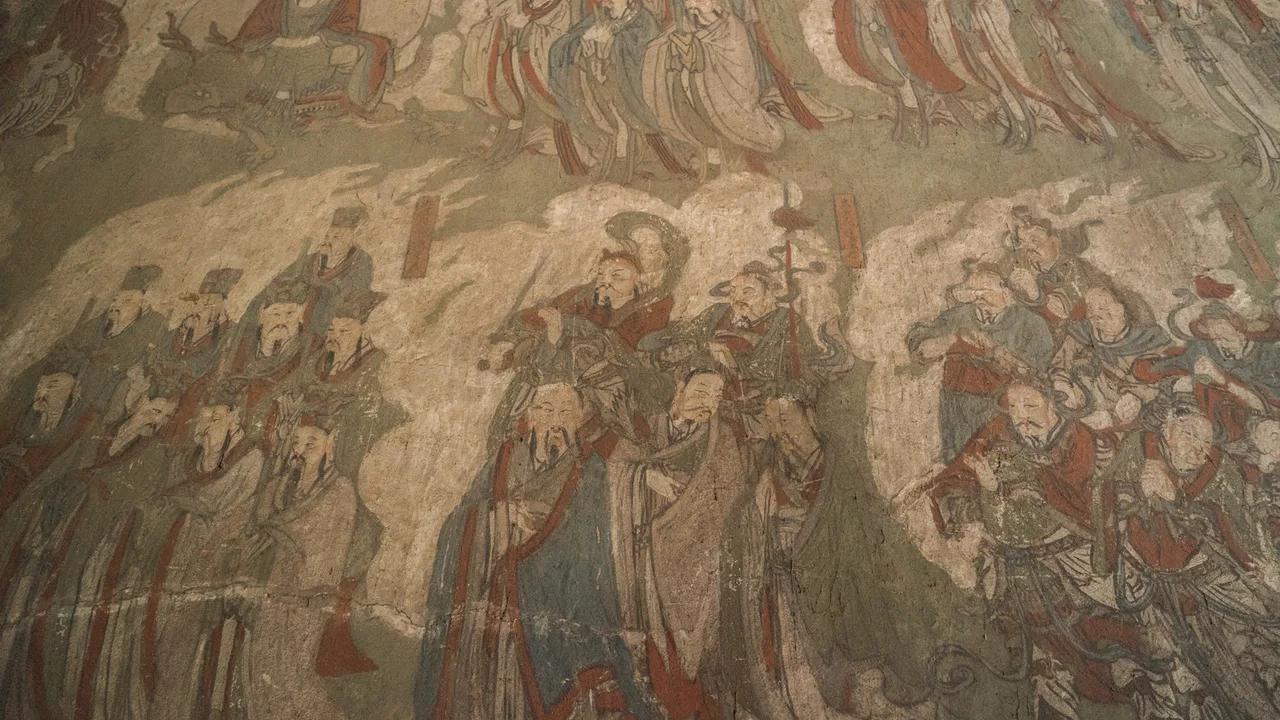 Close view of a painted procession of figures on an interior wall at Taifu Temple, Fenyang.
