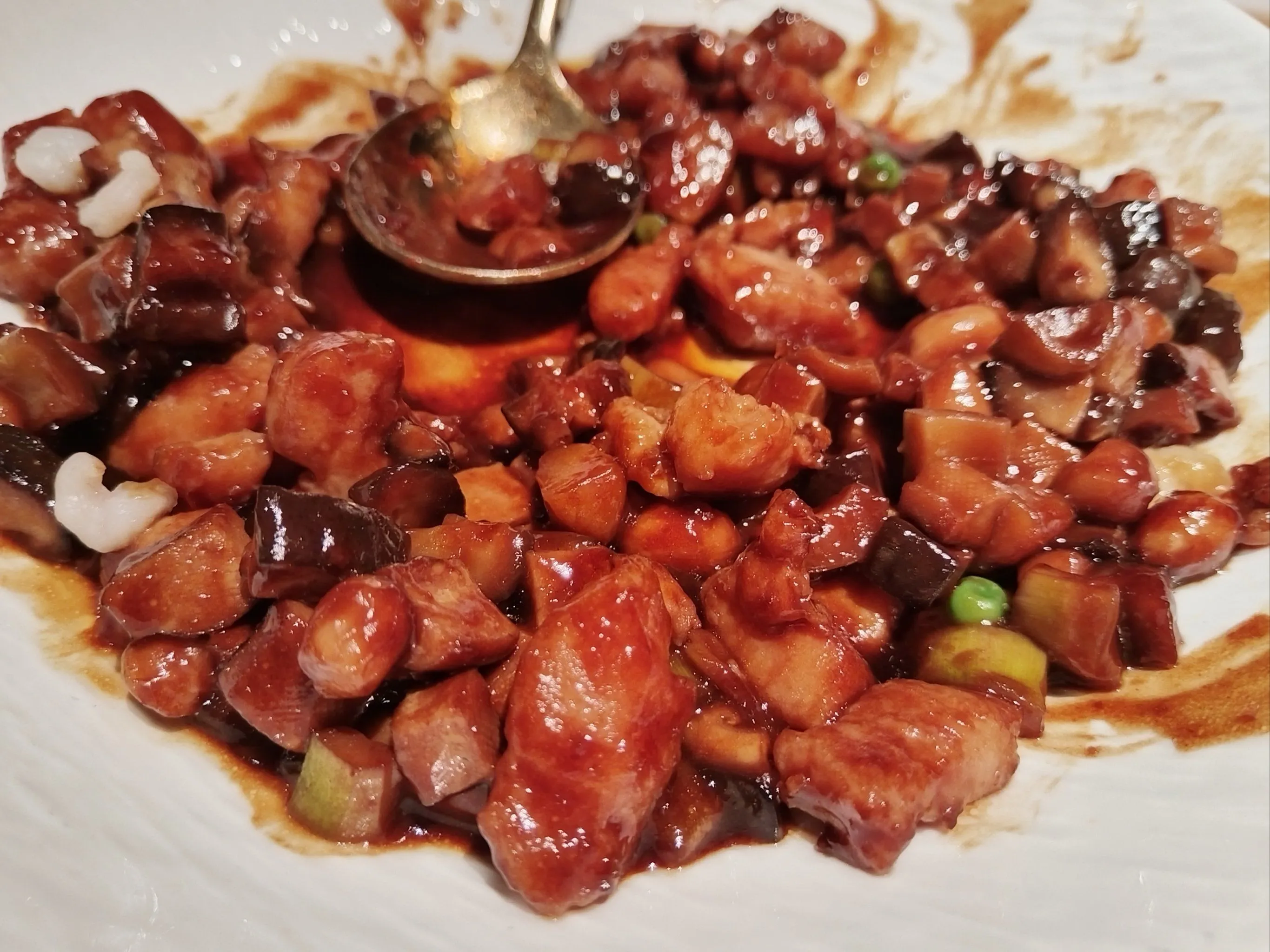 Glistening Shanghainese red-braised pork belly (Hongshao Rou) in a blue and white ceramic bowl.