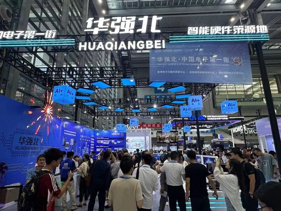Neon signs and crowded multi-story electronics markets in Huaqiangbei, Shenzhen.