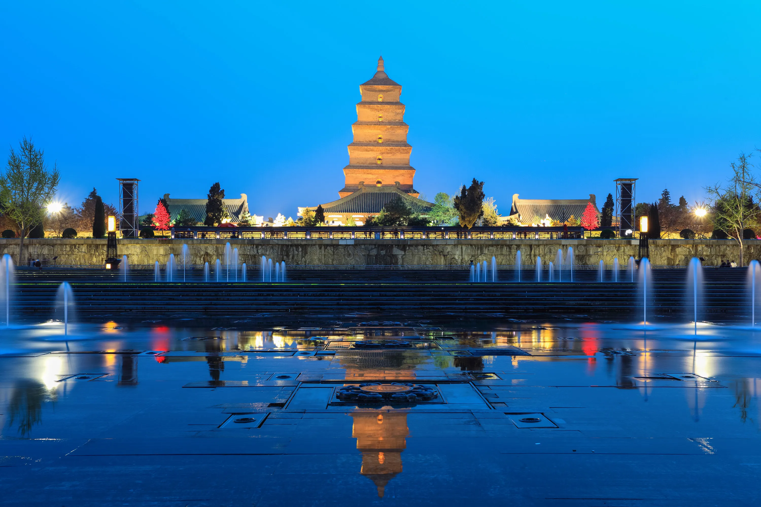 The historic Great Wild Goose Pagoda rising above green gardens in Xi'an.