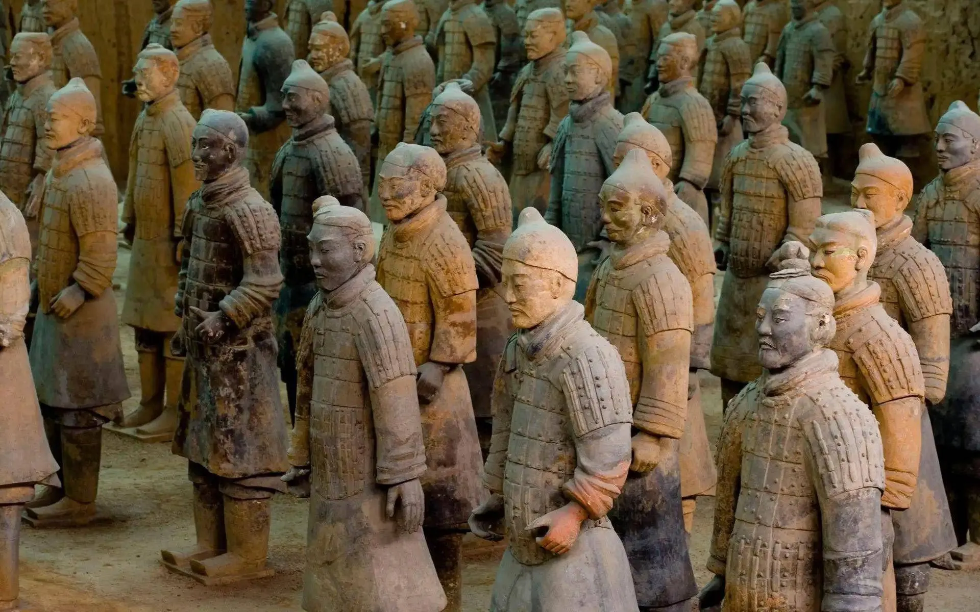 Rows of silent clay soldiers standing in Pit 1 of the Terracotta Army.