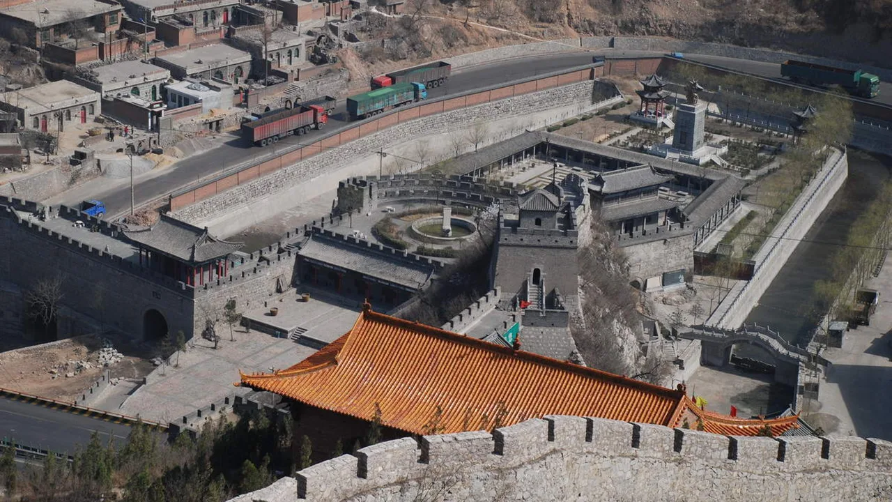 View from the rampart at Guguan over the walled gate fort and village, with the old rail line and highway below (photographed 2008, before the latest restoration).