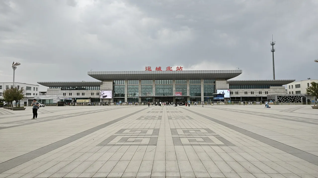 Yuncheng North high-speed railway station seen across its wide paved forecourt.